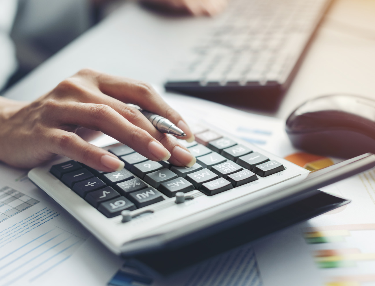 Photo of a woman with a calculator